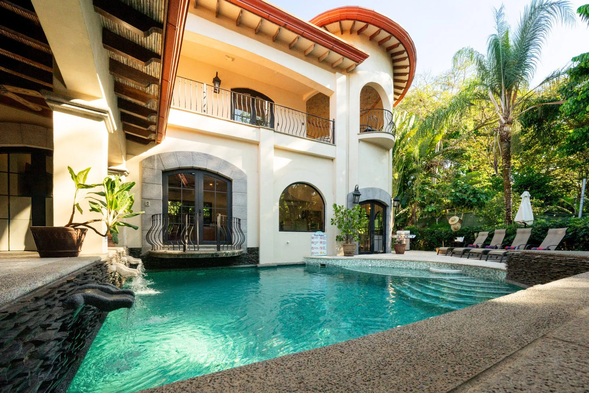 Pool framed by arched balcony