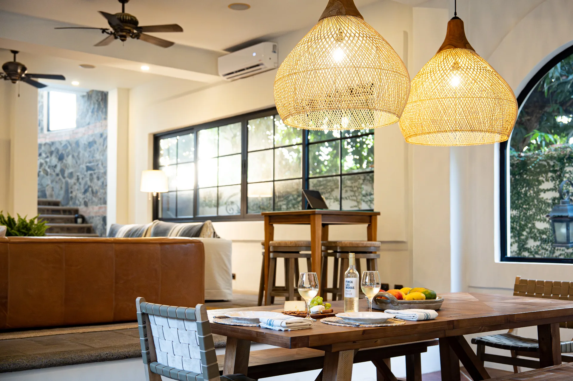 Dining and living room with rattan pendants