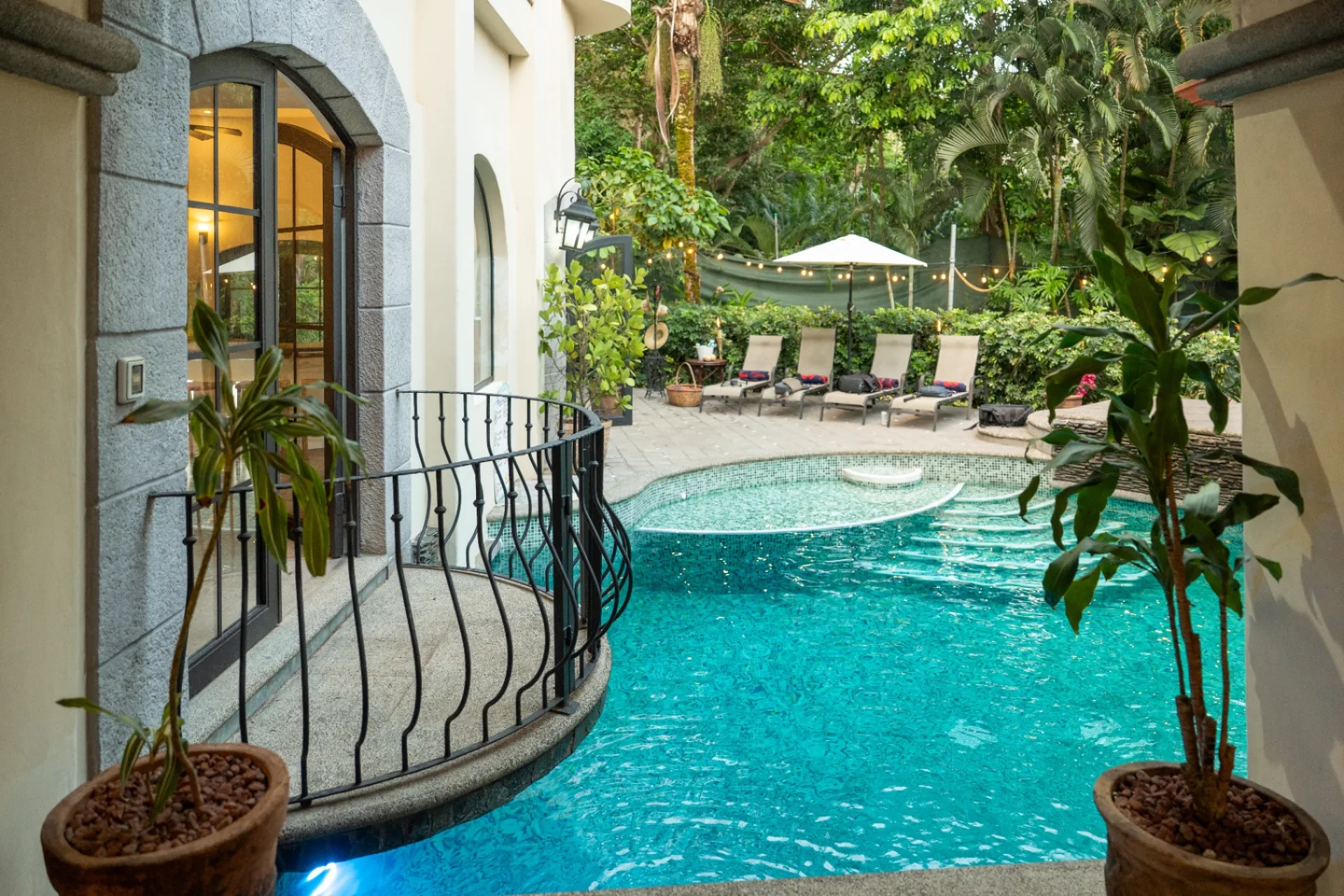 Pool seen from the wrought-iron balcony